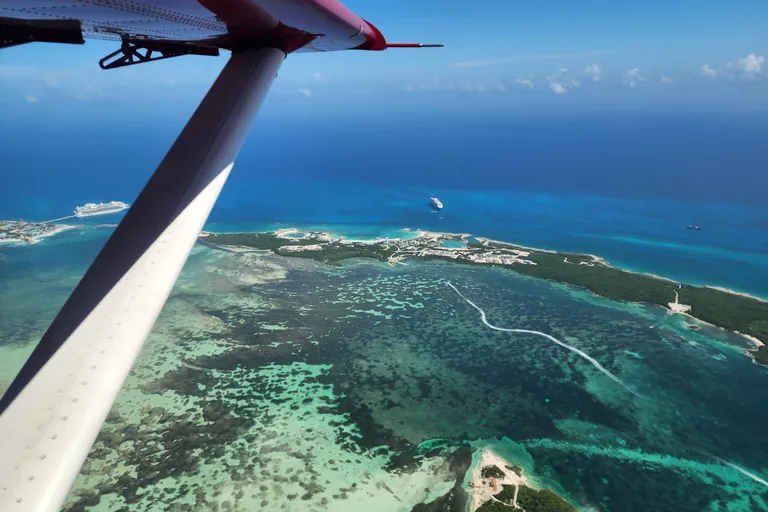 View of wing flying over ocean