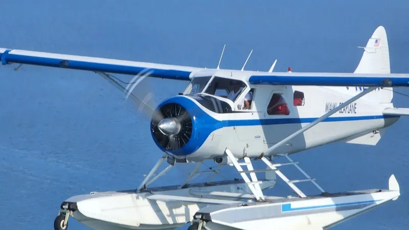 Miami Seaplane flying to Bimini over turquoise waters.
