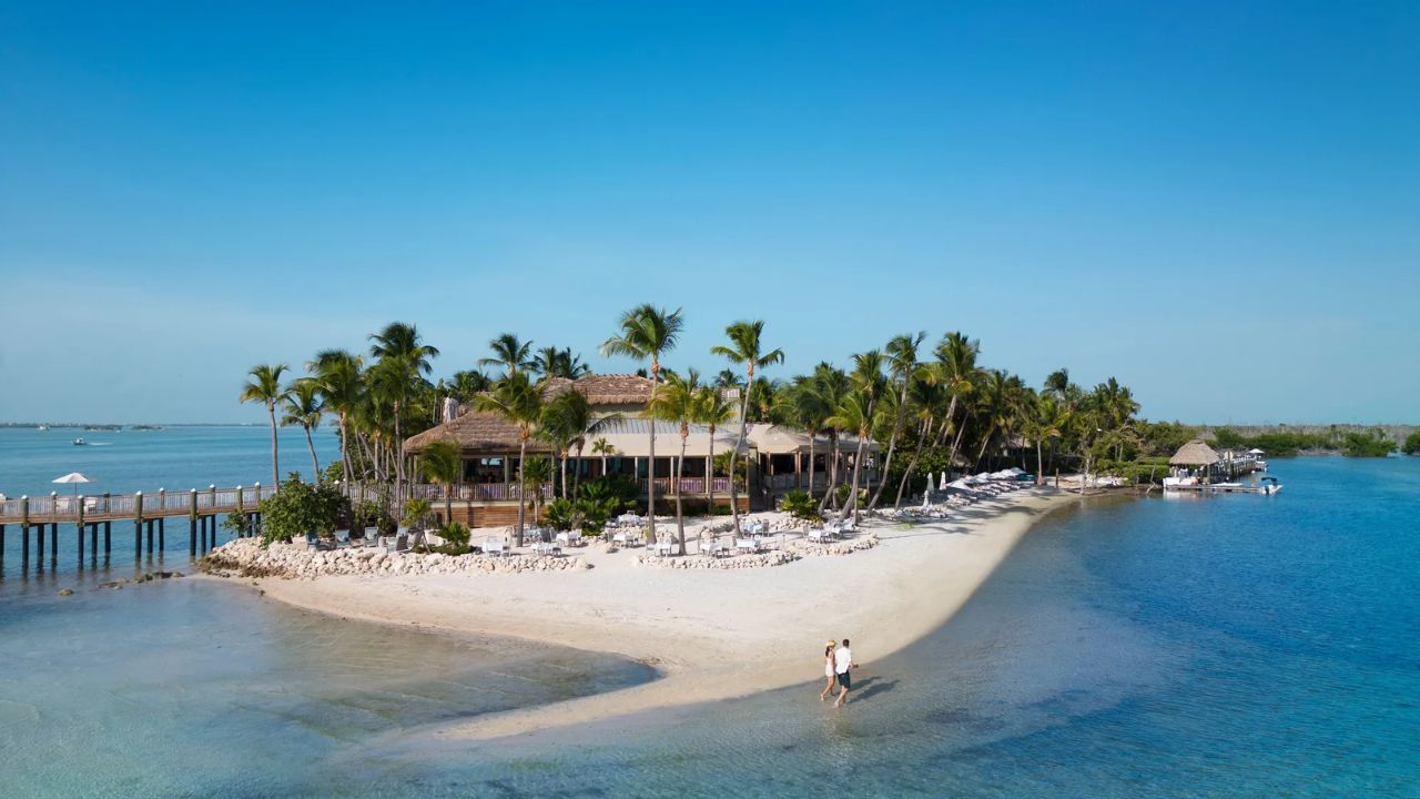 Little Palm Island resort with thatched villas and turquoise water.
