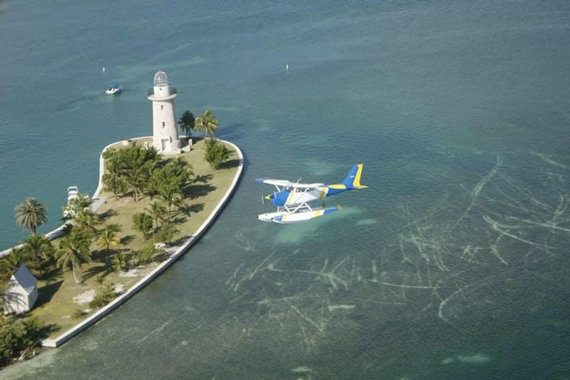 Aerial View of Seaplane and Lighthouse