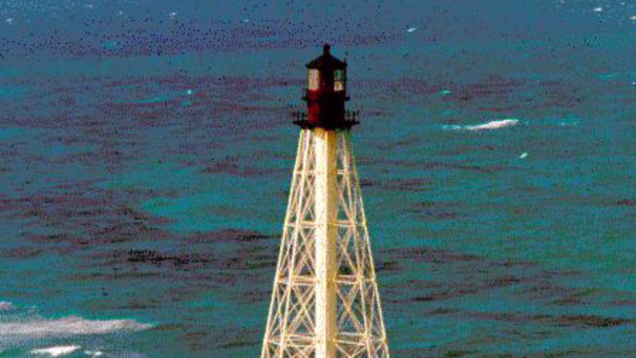 Alligator Reef lighthouse standing above turquoise Florida Keys waters