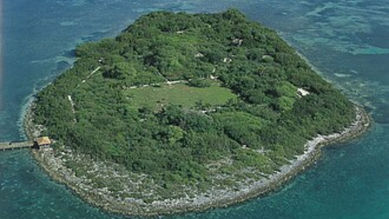  Indian Key island with pier, dense greenery, and clear water